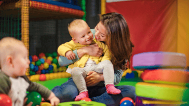 Mum and toddler enjoying the soft play